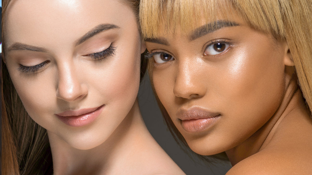 close up of white girl and black girl with amazing skin