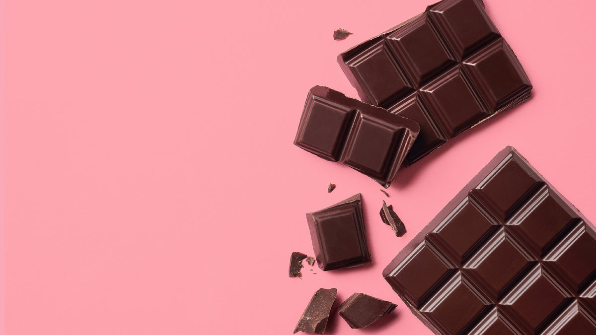 dark chocolate on pink background
