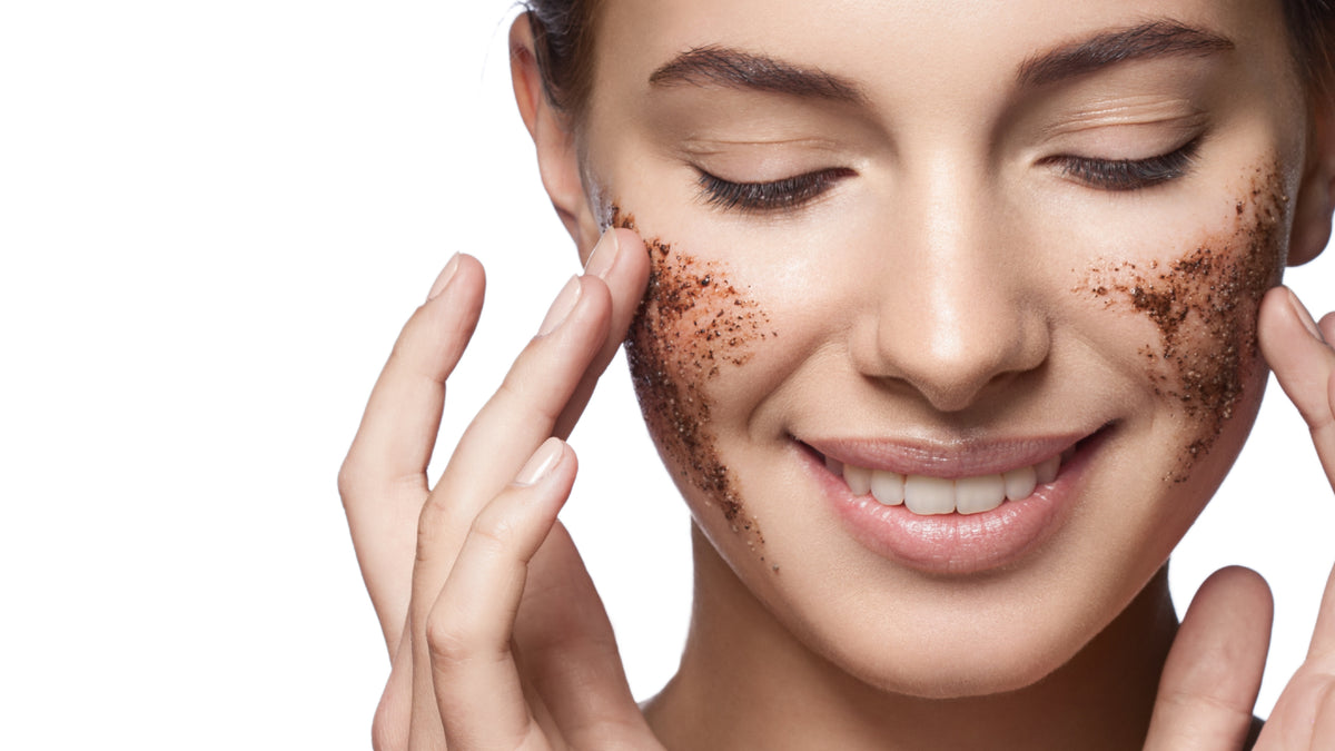 white girl exfoliating skin with brown face scrub