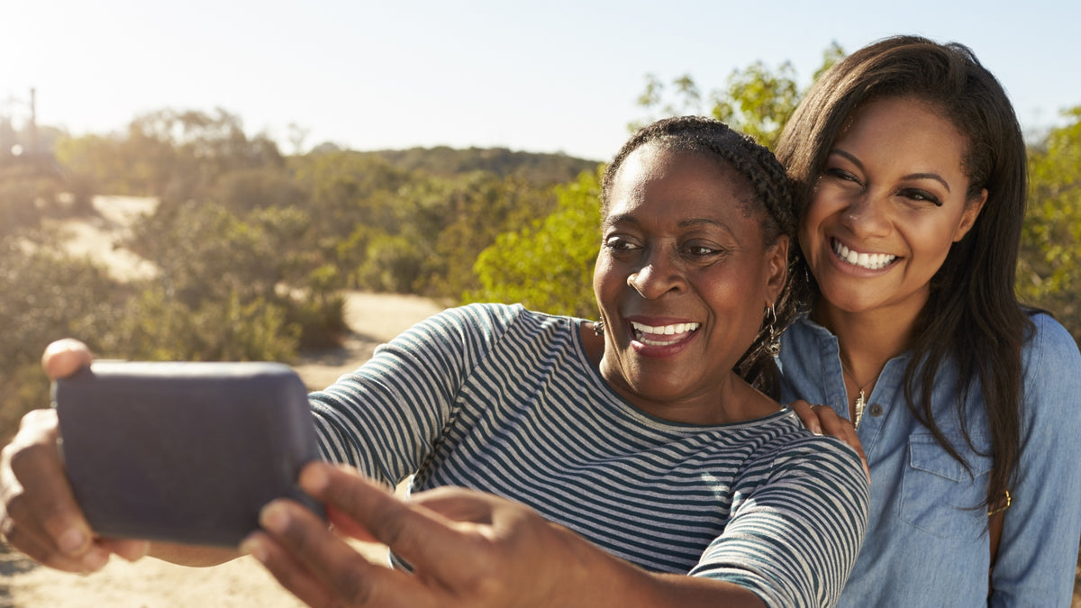 black woman and her mother taking selfie
