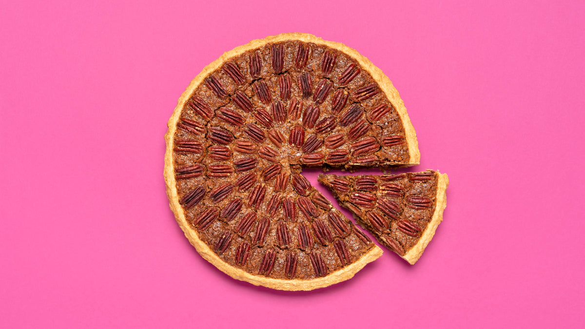 pecan pie shot from above on pink background