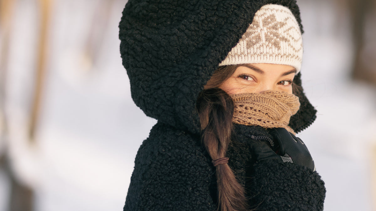 young brunette woman wrapped up on a winter's day