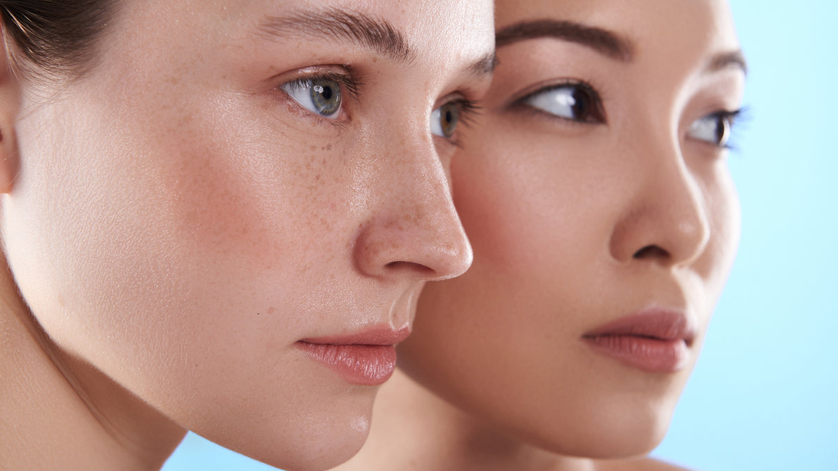 white girl and asian girl with flawless skin