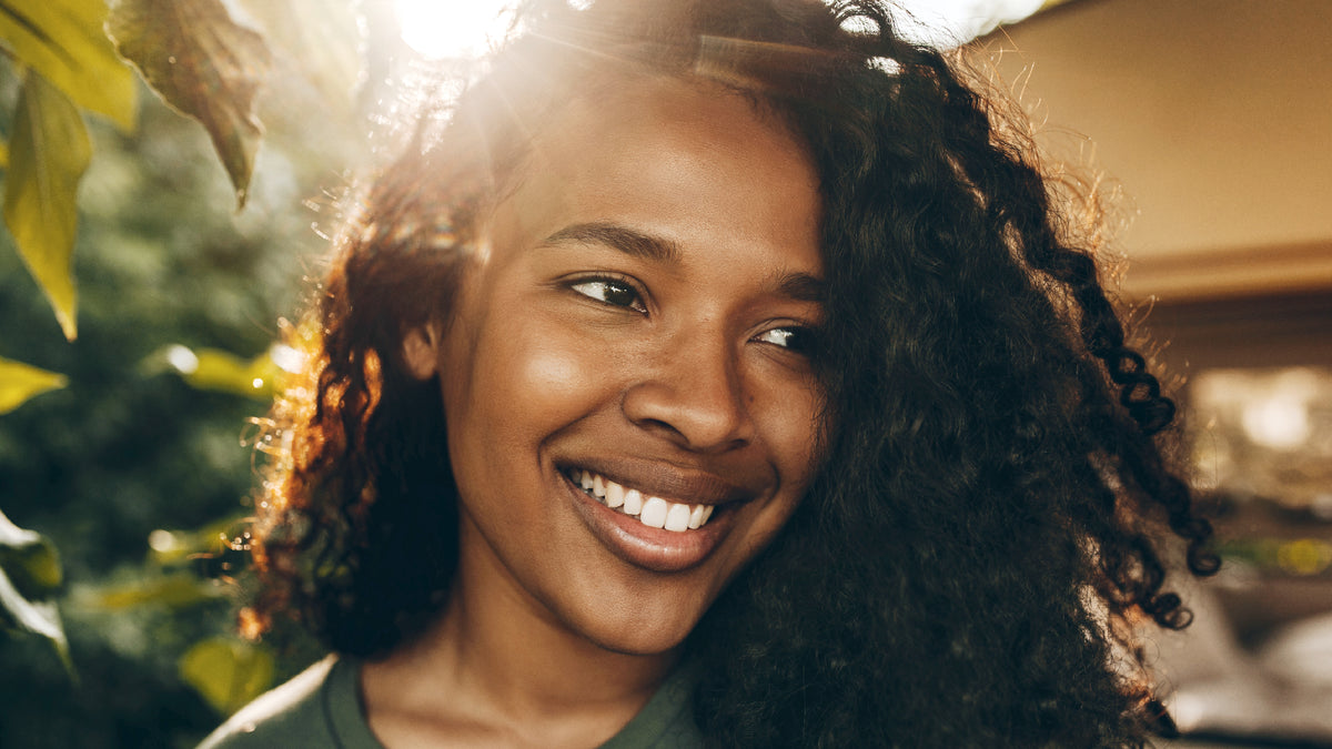 beautiful black woman smiling outside