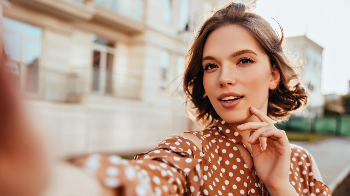 Girl with great skin taking a selfie