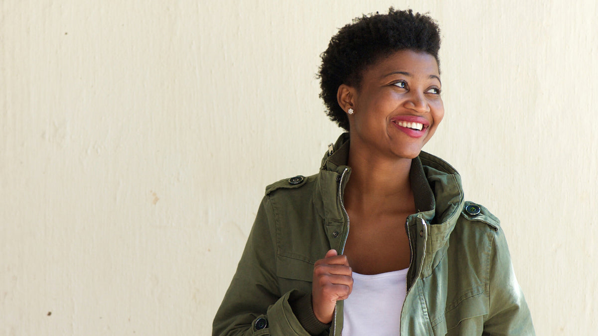 black woman smiling in winter coat