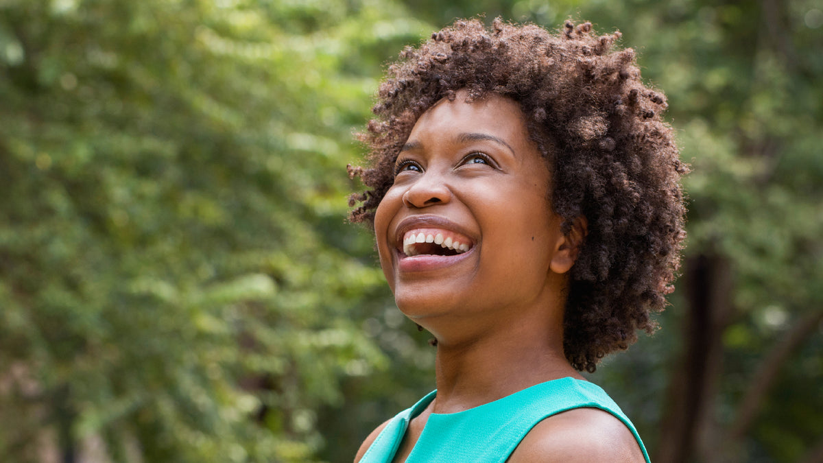 beautiful black woman smiling outdoors